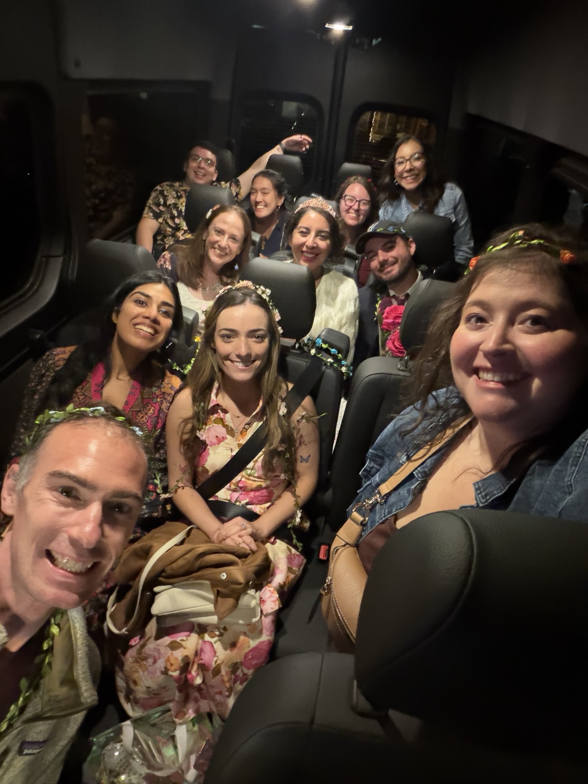 A celebration group smiling together inside the Black Car Adventures Mercedes Sprinter