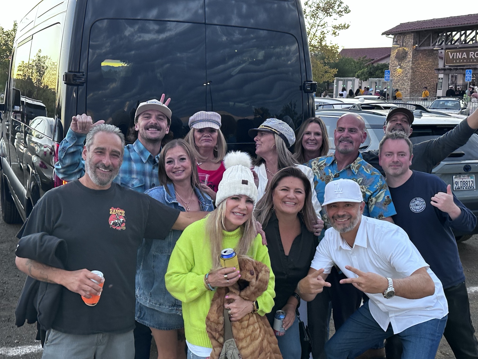 Concert group gathered behind the Black Car Adventures Sprinter van at Vina Robles Amphitheatre